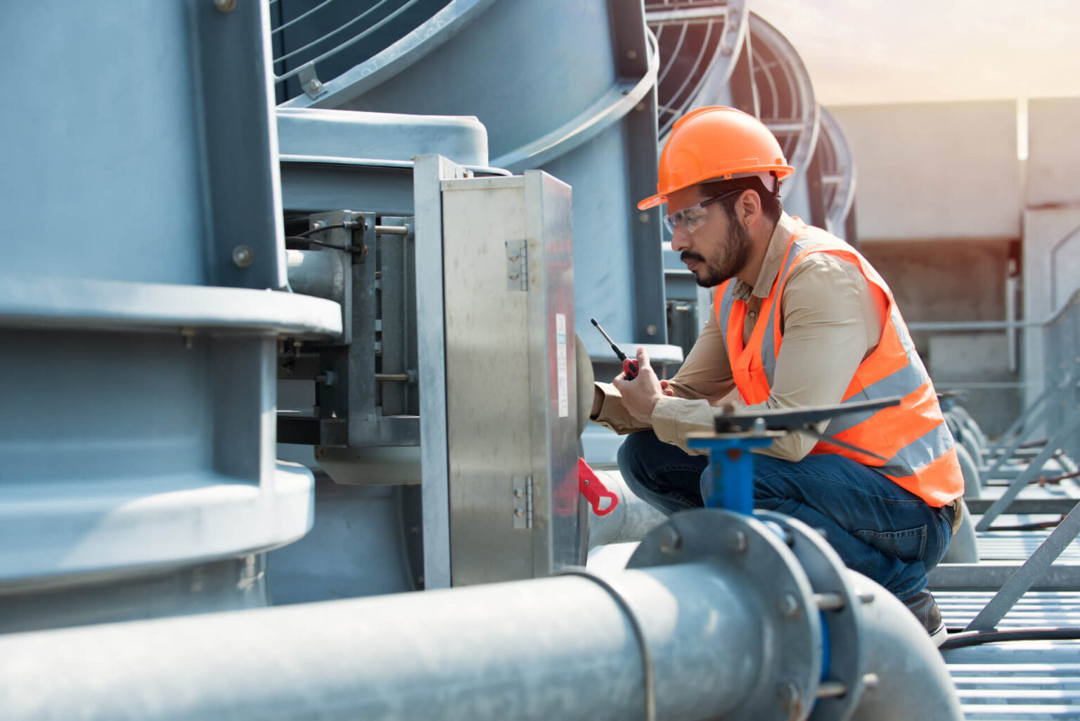 HVAC Technician inspecting HVAC Equipment